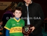 Aaron McHendry from Central Bar Ballycastle presenting Kickhams Creggan 1 team captain Killian McIldowney with the North Antrim Central Bar Division 4 Indoor Hurling league shield